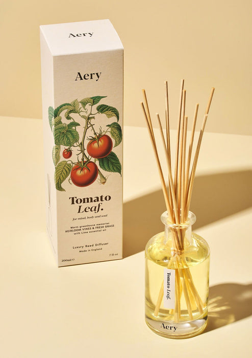 Tomato Leaf diffuser by Aery displayed next to product packaging on yellow bacground