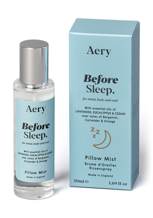 Blue Before Sleep pillow mist by Aery displayed next to product packaging on white bacground 