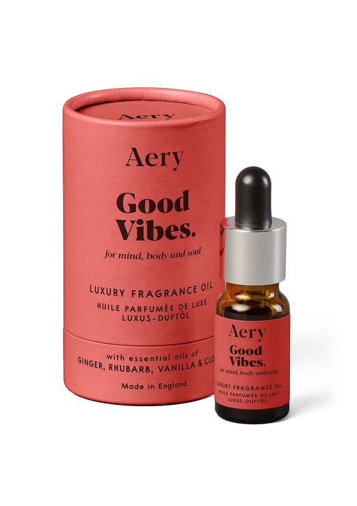 Red Good Vibes fragrance oil by Aery displayed next to product packaging on white bacground 