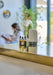 wonderland set of fragrance oils by Aery displayed on gold kitchen surface 