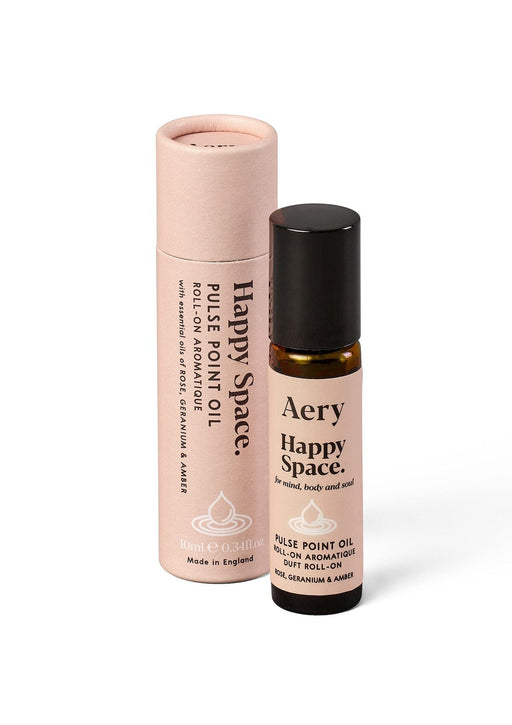 happy space pulse point roll on displayed next to decorative pink packaging